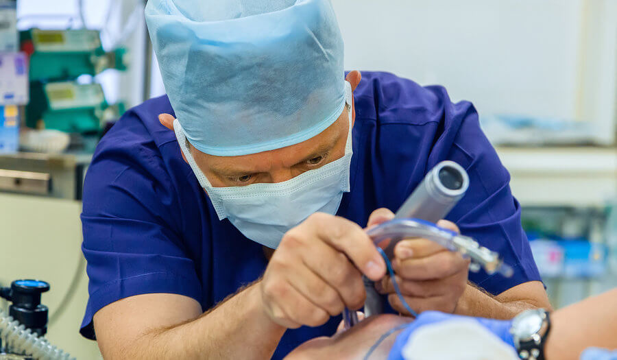 anesthesiologists holding a tube