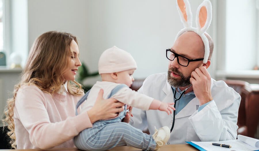 pediatrician checking a baby